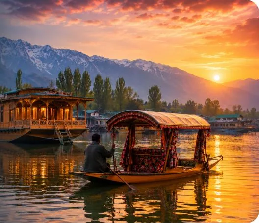 A boatman rowing a canopied shikara past a carved wooden houseboat at sunset